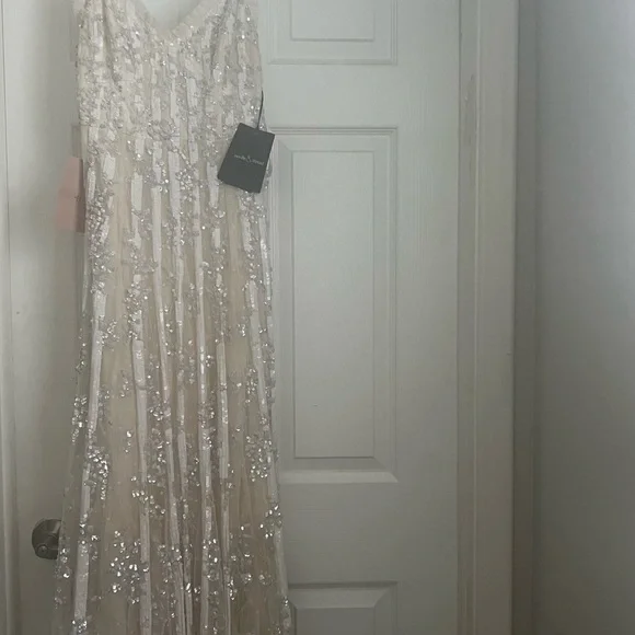 NEEDLE AND THREAD long, sequin gown.